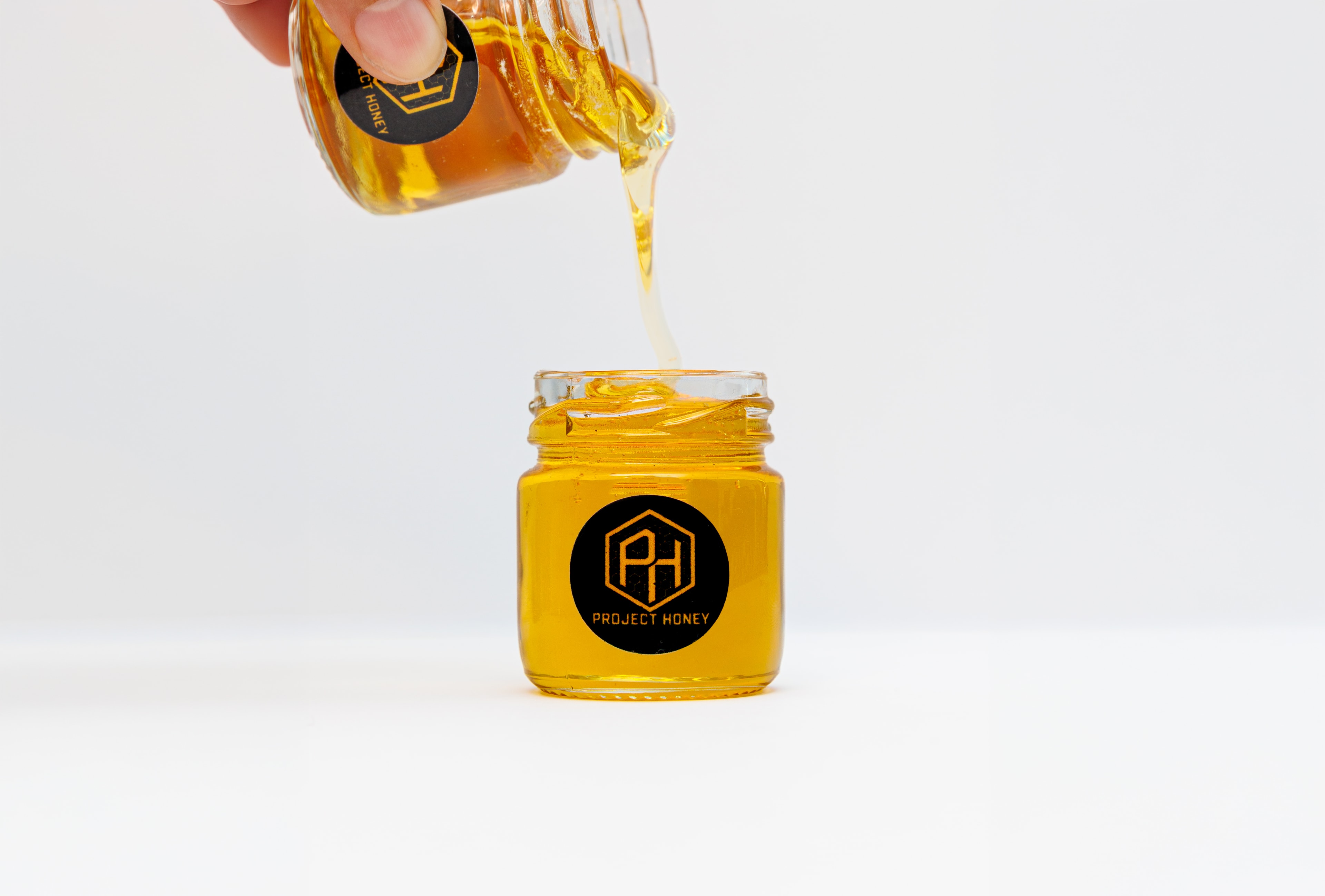 Our story — beekeeper tending hives in golden light